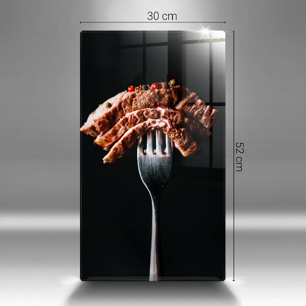 Chopping board glass Meat on a fork