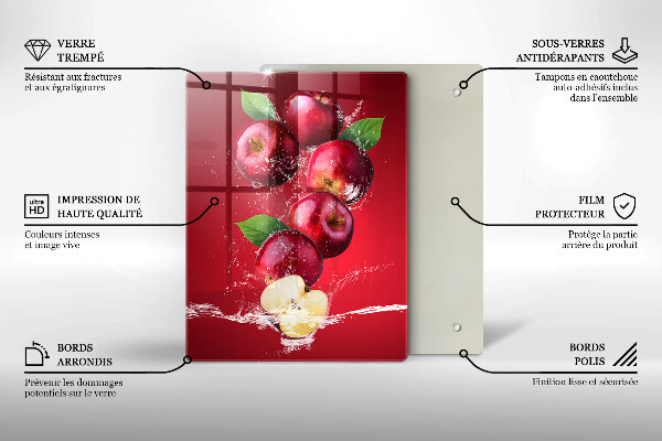 Chopping board glass Juicy apples in the water