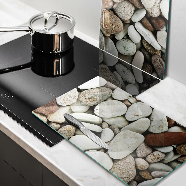Glass chopping board Background small stones