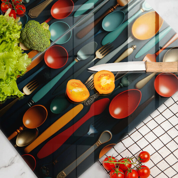 Chopping board Colorful spoons and forks
