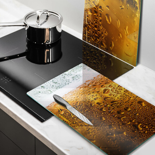 Chopping board Wet glass of beer