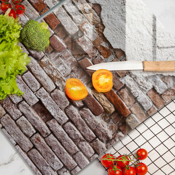 Glass chopping board Old wall of brick and concrete
