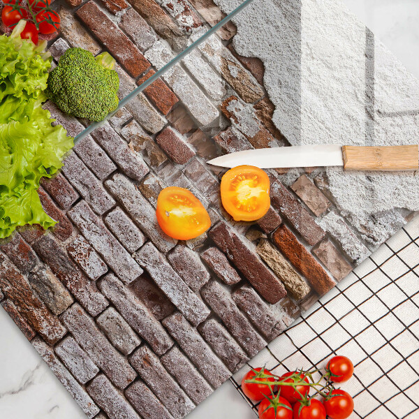 Glass chopping board Old wall of brick and concrete