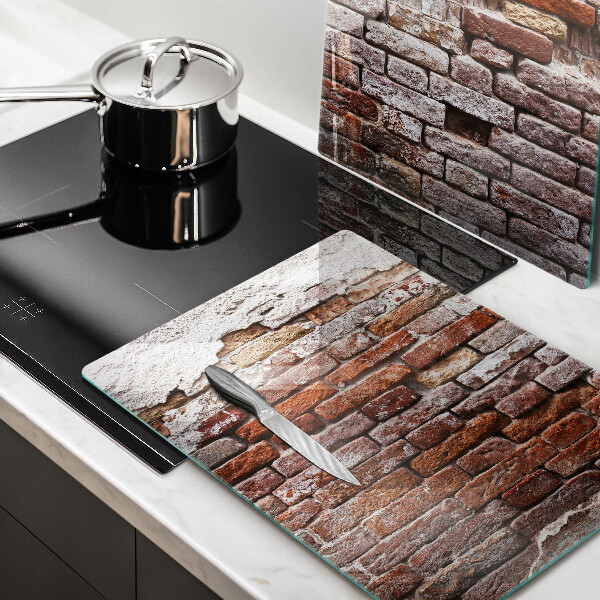 Glass chopping board Old wall of brick and concrete