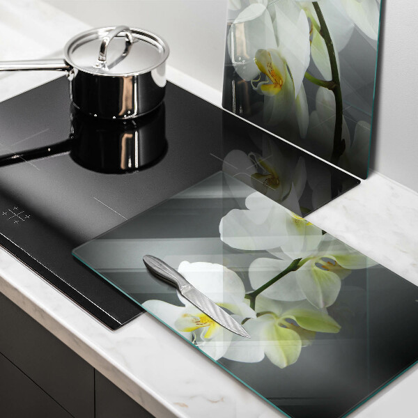 Glass chopping board White orchid flowers