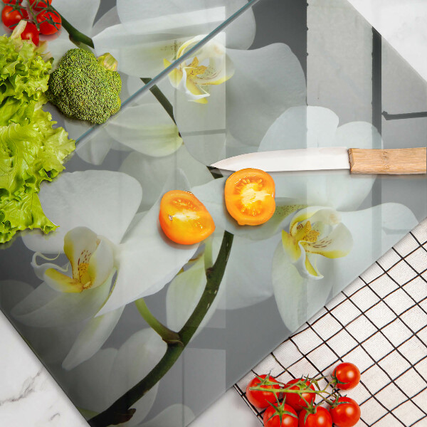 Glass chopping board White orchid flowers