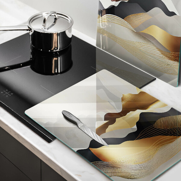 Glass chopping board Abstraction of golden mountains