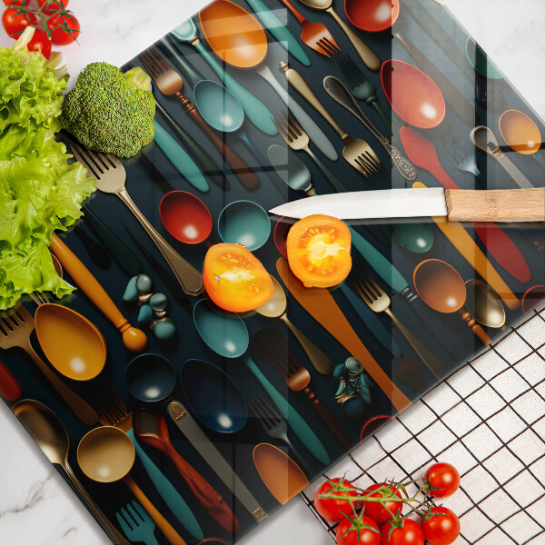 Chopping board Colorful spoons and forks
