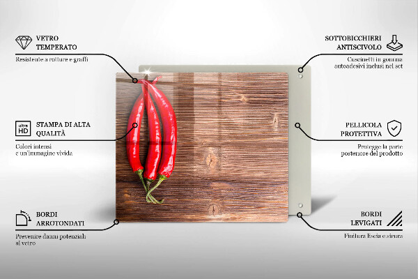 Chopping board glass Chili peppers on wood