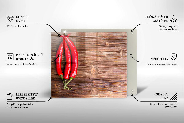 Chopping board glass Chili peppers on wood