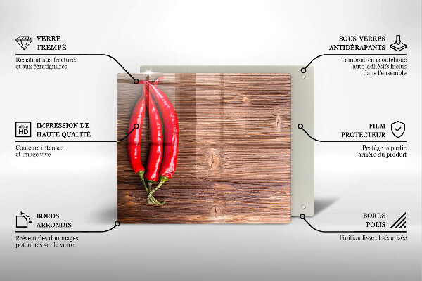 Chopping board glass Chili peppers on wood