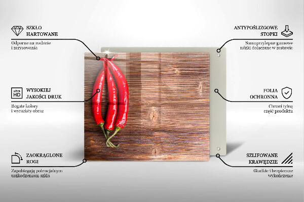 Chopping board glass Chili peppers on wood