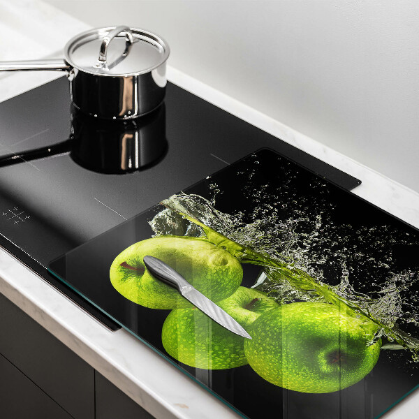 Chopping board glass Green apples and water