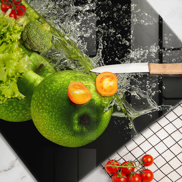 Chopping board glass Green apples and water