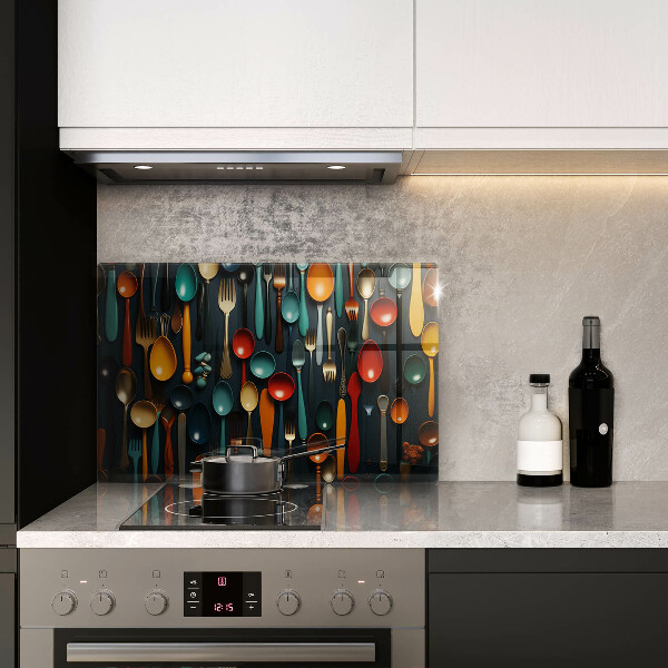 Chopping board glass Colorful spoons and forks