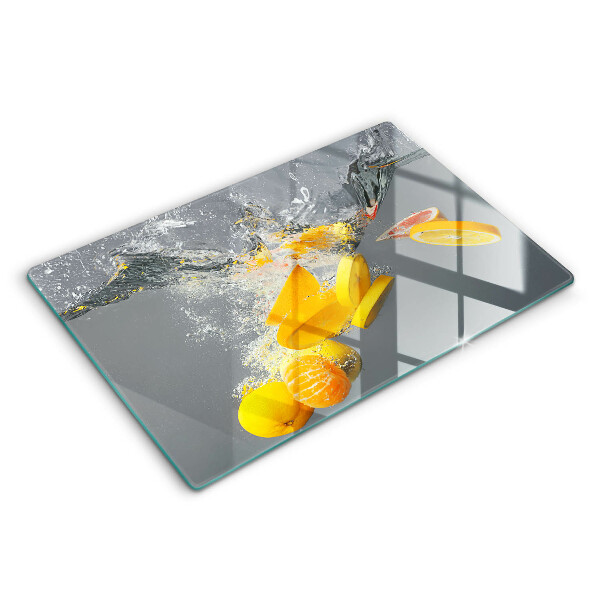 Chopping board glass Lemons in water