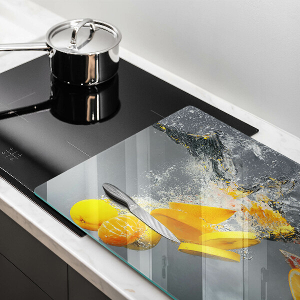 Chopping board glass Lemons in water
