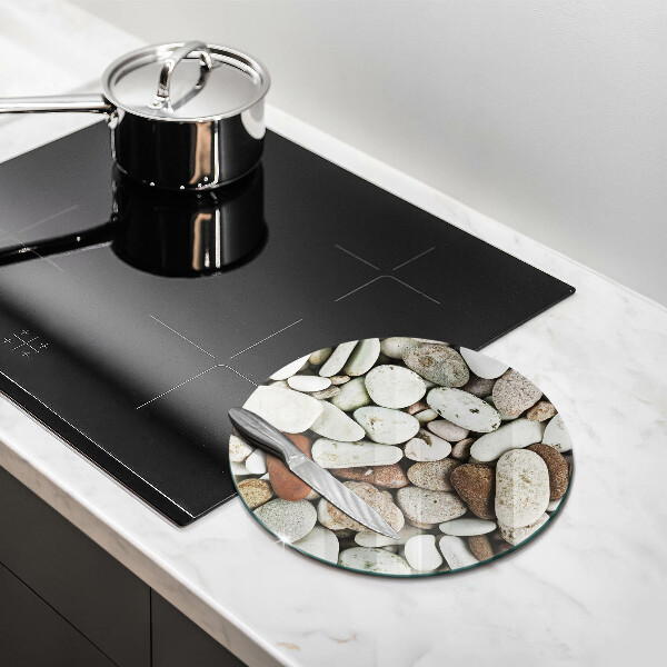 Chopping board glass Background small stones