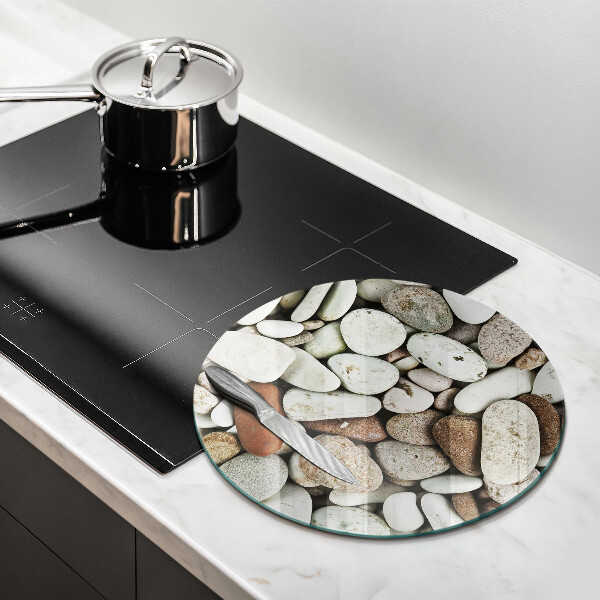 Chopping board glass Background small stones