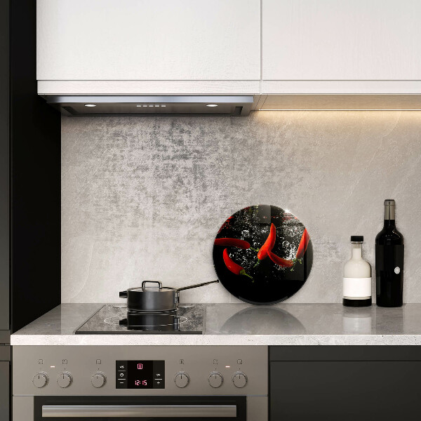 Chopping board glass Chili peppers in water