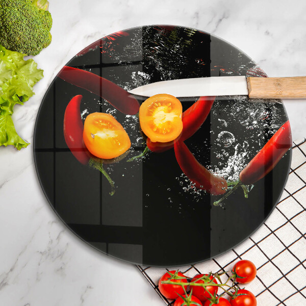 Chopping board glass Chili peppers in water