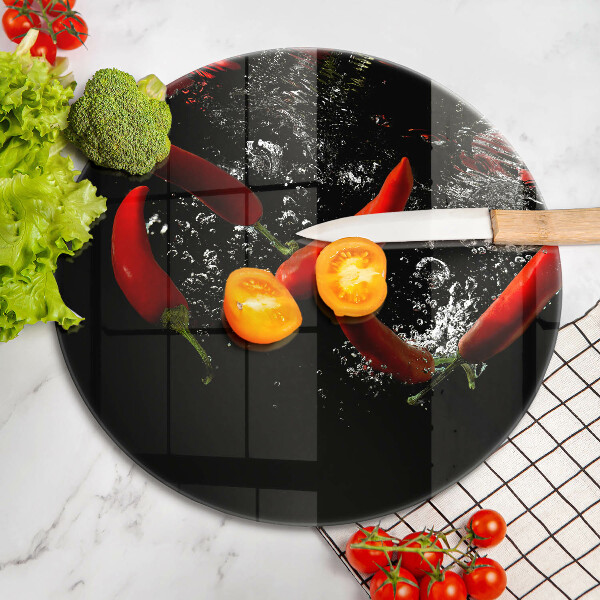 Chopping board glass Chili peppers in water