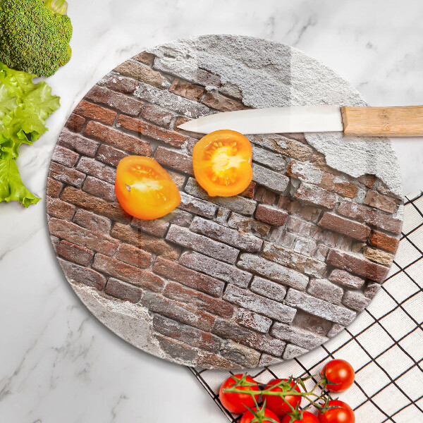 Chopping board glass Old wall of brick and concrete