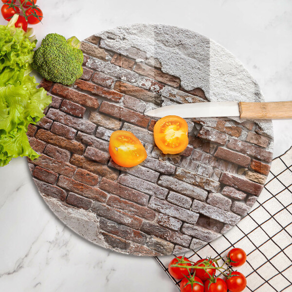Chopping board glass Old wall of brick and concrete
