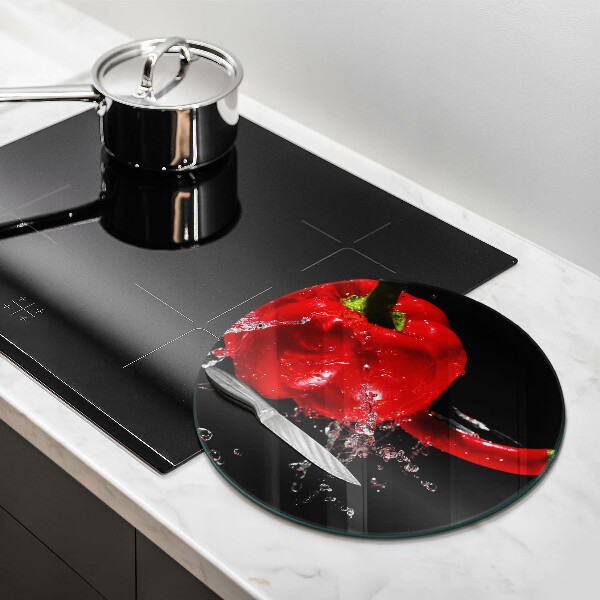 Chopping board glass Red peppers in water