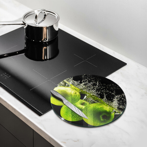 Chopping board glass Green apples and water