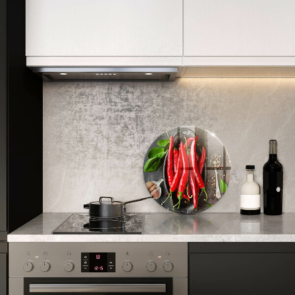 Chopping board glass Red chili peppers