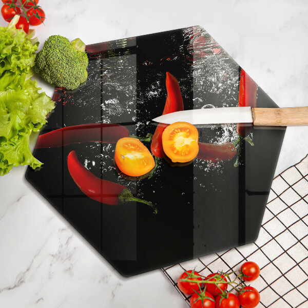 Chopping board glass Chili peppers in water
