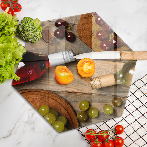 Chopping board Bottles of wine and grapes