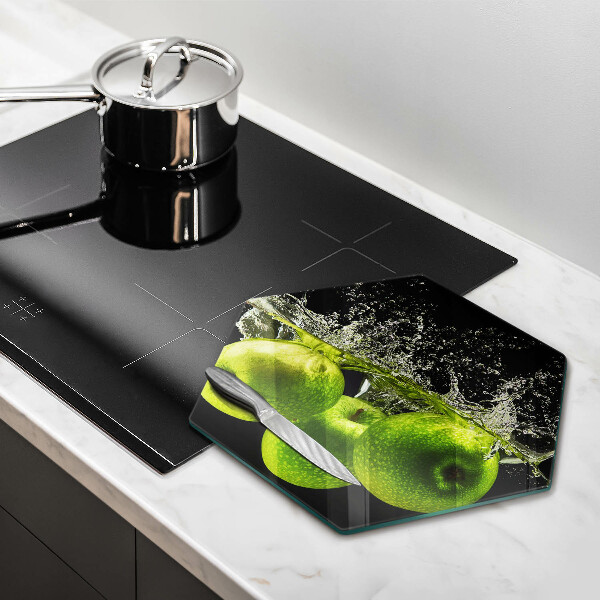 Chopping board glass Green apples and water