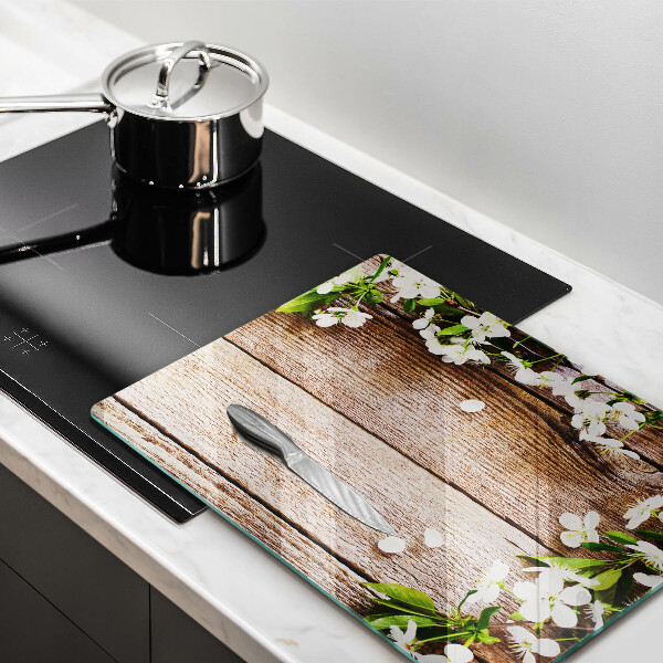 Induction hob protector White flowers on the boards