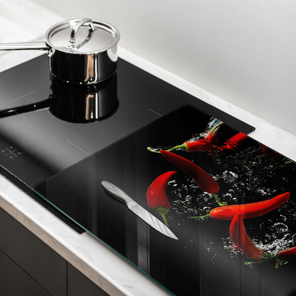 Induction hob protector Chili peppers in water