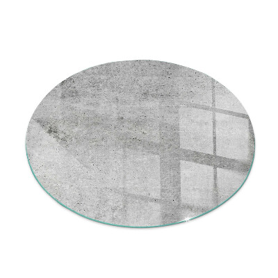 Round glass wood burner hearth Raw concrete texture