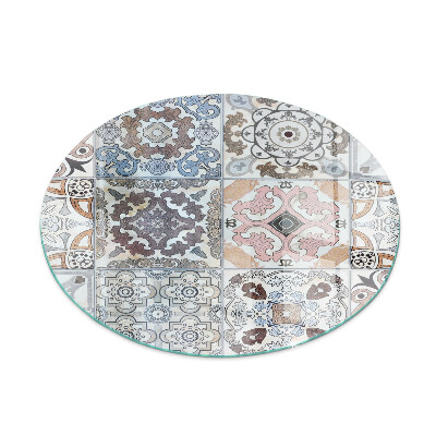 Round glass wood burner hearth Mosaic patterns in tiles