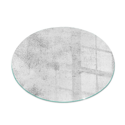 Round glass wood burner hearth Raw concrete texture