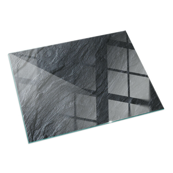 Rectangular glass hearth for log burner Stone surface texture