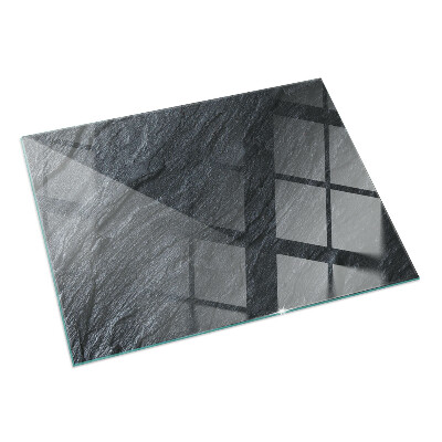 Rectangular glass hearth for log burner Stone surface texture
