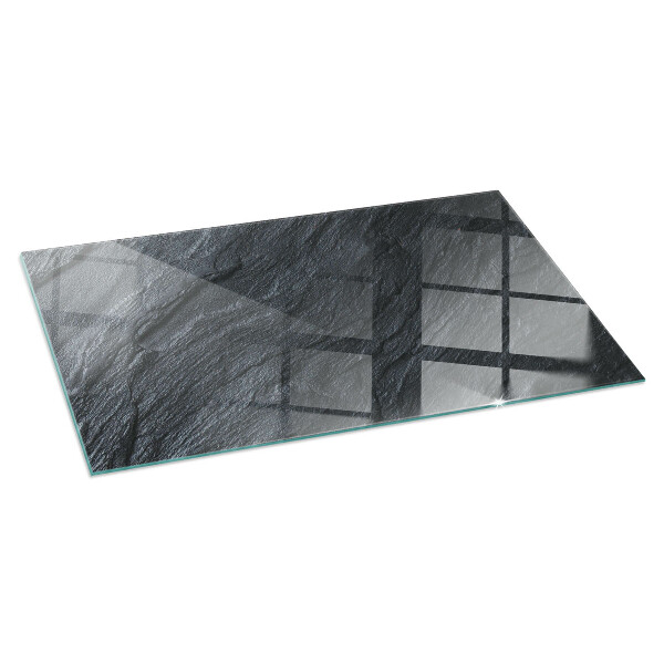 Rectangular glass hearth for log burner Stone surface texture