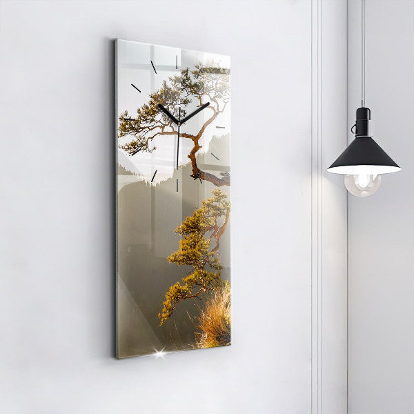 Vertical wall clock A tree in the mountains