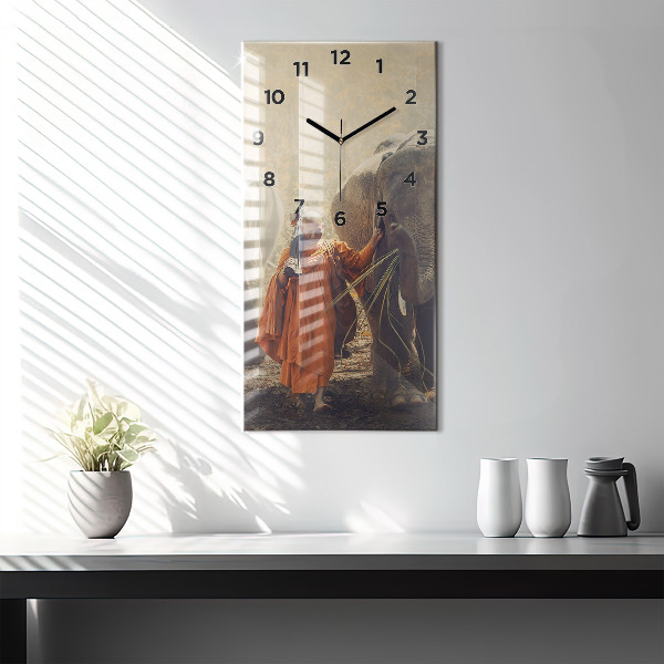 Vertical wall clock Monk leading elephants