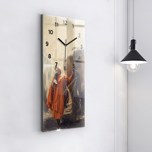 Vertical wall clock Monk leading elephants