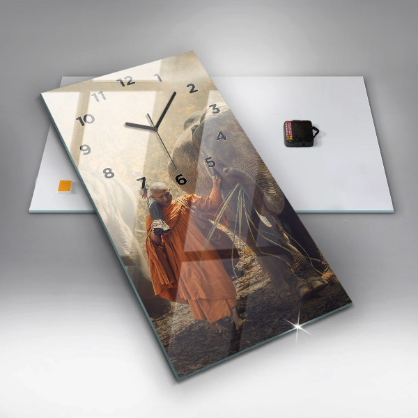 Vertical wall clock Monk leading elephants