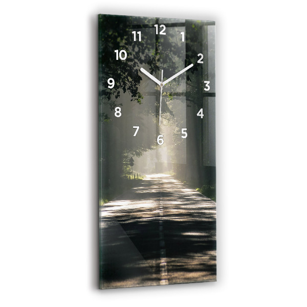 Vertical wall clock Forest road and streaks of sunlight