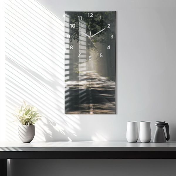 Vertical wall clock Forest road and streaks of sunlight