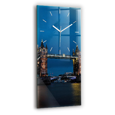 Vertical wall clock Tower Bridge London at night