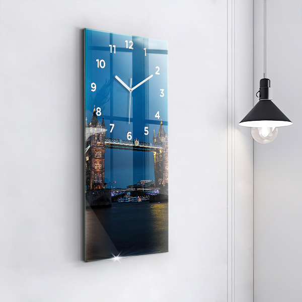 Vertical wall clock Tower Bridge London at night